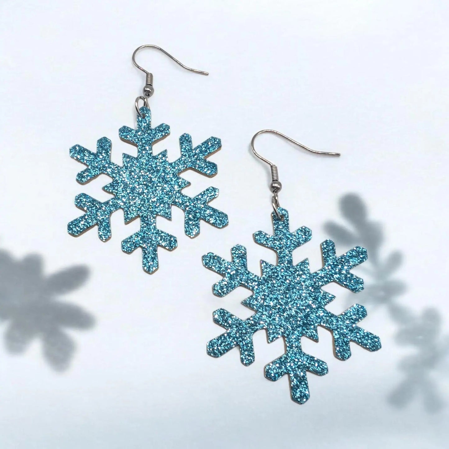 Blue glitter snowflake earrings